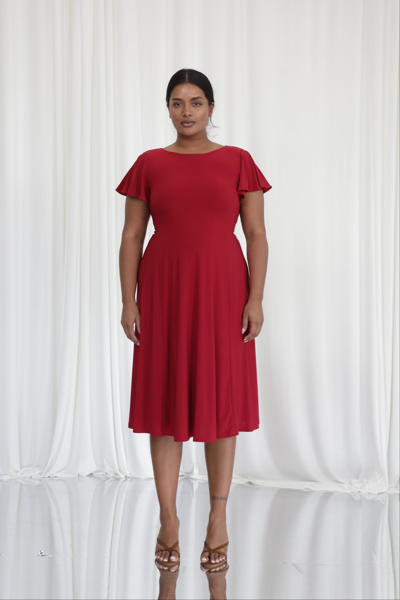 Ava Reversible Midi Dress in Merlot Red worn by model Sha, UK size 16, height 5'9"