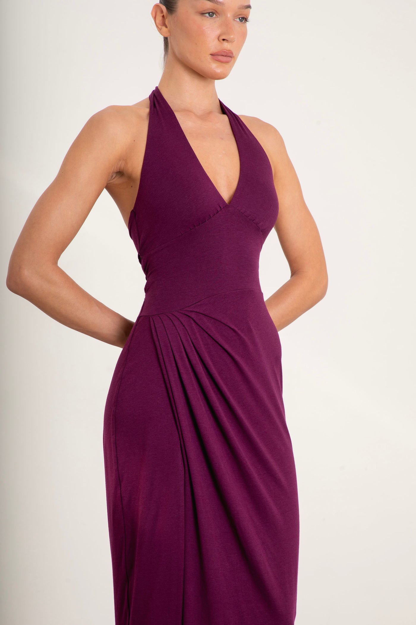 Front view of Divine Dress halterneck maxi dress in plum color with full lining
