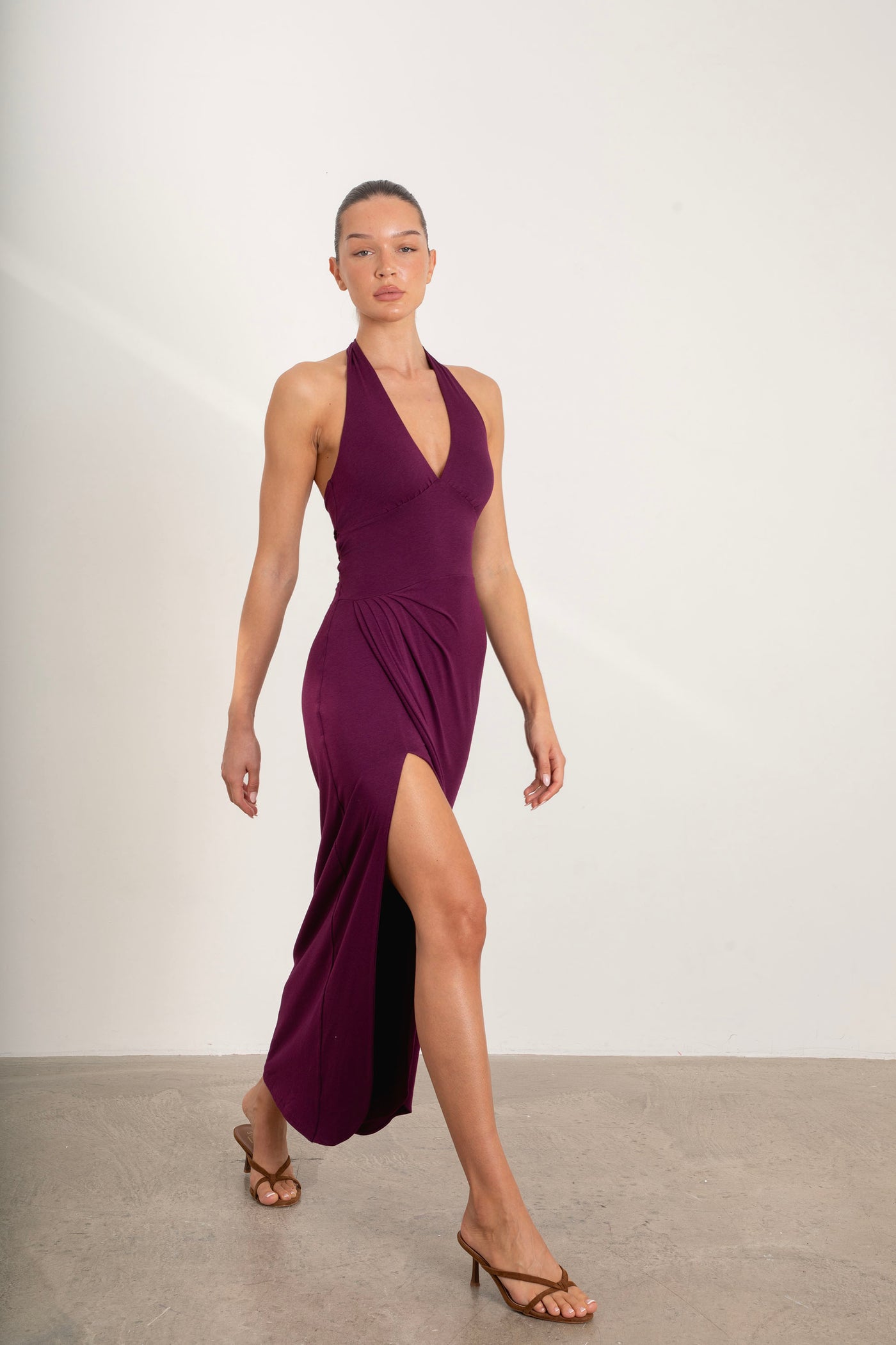Divine Dress plum halter maxi dress showcasing full length and flowy silhouette