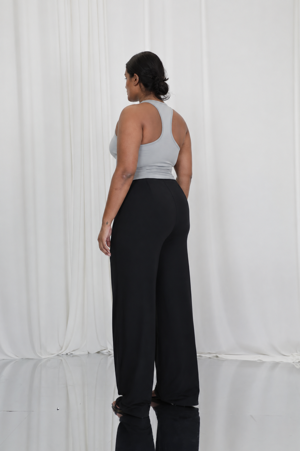 Finsbury black sculpting trousers featuring high waisted design and smooth drape fabric
